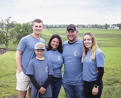 The Levetzow family – (front) Earl; (back, from left) Bo, AmyBeth, Kyle and Tessa – stand on their farm near Dodgeville, Wisconsin where the Iowa County Dairy Breakfast took place June 4. The farm hosted over 2,000 people for breakfast. PHOTO SUBMITTED