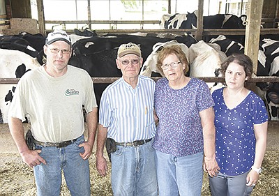 The Mohr family – (from left) Scott, Roger, Anita and Sarah – milks 100 cows and farms 350 acres of land in Brown County near Sleepy Eye, Minnesota. Roger Mohr began dairy farming 54 years ago. PHOTO BY MARK KLAPHAKE
