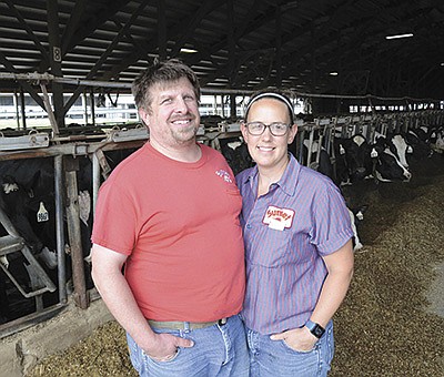 Darren and Karen Hughes are part owners of Sunset Farms where they milk 1,200 cows and farm 3,500 acres near Allenton, Wisconsin. Karen is the farm’s herd manager and Darren is the assistant herdsman and feed manager.  PHOTO BY STACEY SMART