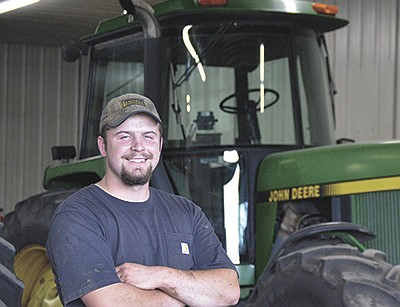 Luke Sprecher takes a break from tractor maintenance June 22 at the Enges’ farm near Sauk City, Wisconsin. Sprecher was the recipient of the Wisconsin State FFA Star in Agricultural Placement which highlighted his work on the dairy farm.  PHOTO BY ABBY WIEDMEYER