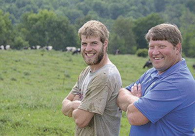 Brett (left) and Darin Von Ruden stand in the pasture June 10 at their organic farm near Westby, Wisconsin. The father-son duo is in their seventh year of transitioning ownership to Brett. PHOTO BY ABBY WIEDMEYER