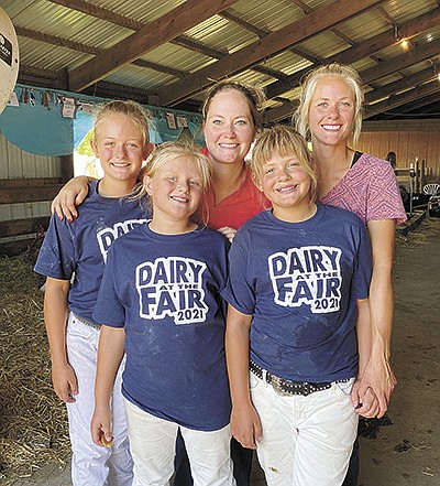 The Jaeger sisters (front, from left) – Addy, Briea and Ella – gather with Megan Herberg (back, center) and their mom, Amanda Jaeger, during the Nicollet County Fair in 2021. The Jaegers lease dairy animals from Herberg and her family. PHOTO SUBMITTED