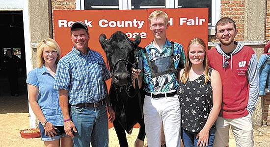The Martin family – (from left) Bonnie, Joe, Evan, Abigail  and her husband, Calvin – pose at the Rock County Fair during the family’s final time showing at the fair. The Martins’ 200-cow dairy is located near Janesville, Wisconsin. PHOTO SUBMITTED