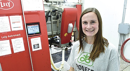 Quinci Scherber is the herdswoman on her family’s 110-cow dairy farm near Rogers, Minnesota. The family installed two Lely A5 milking robots last summer. PHOTO BY JENNIFER COYNE