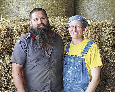 Keith and Jacqui Davison take a break Aug. 18 at the dairy near Hillsboro, Wisconsin. The Davisons are both battling cancer while farming full time. A benefit will be held in their honor Sept. 24.  PHOTO BY ABBY WIEDMEYER