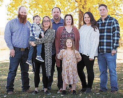 The Souza family – (from left) Ryan Anderson, Jayce Anderson, Hayley Anderson, Kevin Souza, Suzanne Souza, Kylyn Anderson, Audrey and Brandon Peschong – operate a 5,000-cow Jersey dairy farm in Revillo, South Dakota. PHOTO SUBMITTED