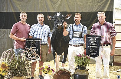 Oak-Ridge-K Gchip Turbo is named the senior and grand champion of the Wisconsin Championship Holstein Show Aug. 26 in Madison, Wisconsin. Pictured with Turbo, from left, are owners Jared and Peter Dueppengiesser, John Vosters and Jim Ostrom.  PHOTO COURTESY OF DAIRY AGENDA TODAY
