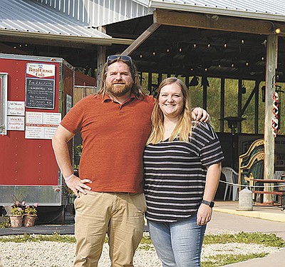 The Grover siblings, Rob and Sarah, stand outside their pizza farm Sept. 14 near Galesville, Wisconsin. The siblings run an outdoor pizza venue with Rob’s business partner, Greg Roskos. PHOTO BY ABBY WIEDMEYER