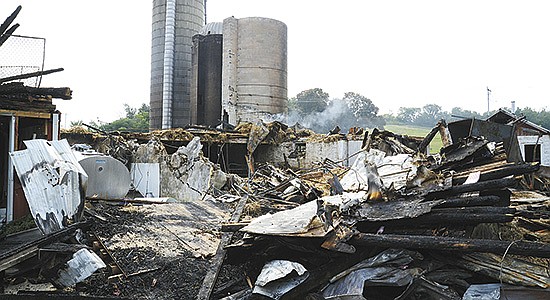 The Plucinskis’ barn lies in ruins Sept. 14 three days after a fire took down the 48-stall tiestall barn near Jefferson, Wisconsin. All of the farm’s bedding and dry hay for the winter was lost. PHOTO BY STACEY SMART