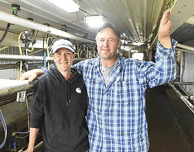 Ann and Allan Middendorf stand in their swing-10 parlor Sept. 13 on their organic dairy near Long Prairie, Minnesota. The Middendorfs have been milking cows together for 30 years and earlier this year started milking in their parlor.  PHOTO BY MARK KLAPHAKE