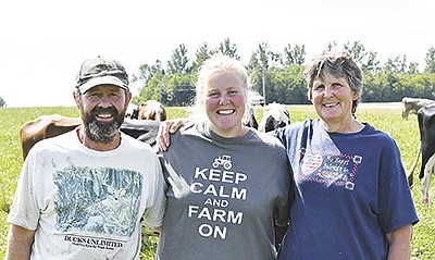 Mike (from left), Anna and Keri Salber operate an organic dairy farm near Browerville, Minnesota. They milk 79 cows and have been certified organic since 2003.  PHOTO BY GRACE JEURISSEN