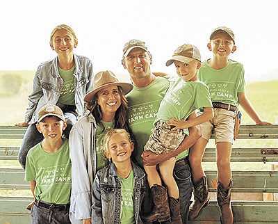 The Berning family – (front) Celia, (middle, from left) Aloysius, Natalie, Matt holding Rhett, (back) Willa and Louis – host farm tours and camps at their 400-cow dairy near Menominee, Illinois. PHOTO SUBMITTED