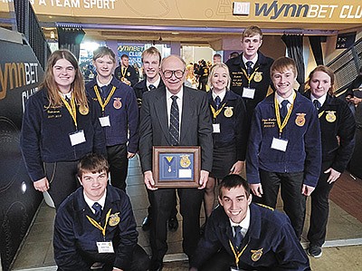 Mike Sabel (center) stands with Auburndale FFA Chapter members – Brett Thiel (front, from left) and Chuck Jewell; (middle, from left) Sara Snortheim, Allis Teska and Coleman Becker; (back, from left) Gabe Willfahrt, Matt Bohman, Nathan Nikolay and Abby Becker – at the 95th National FFA Convention and Expo in October in Indianapolis, Indiana. Sabel was awarded the Honorary American FFA Degree. PHOTO SUBMITTED
