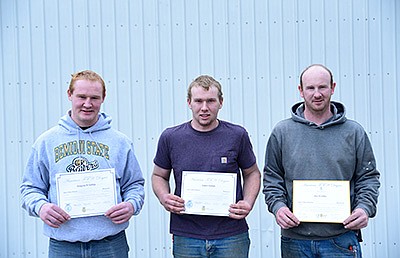 Greg (from left), Jonathon and Joe Gathje stand with their American FFA Degree certificates Nov. 12 at their parents’ dairy farm near Eden Valley, Minnesota. Siblings Anne, James and Katherine Gathje also received the American FFA Degree. PHOTO BY TIFFANY KLAPHAKE
