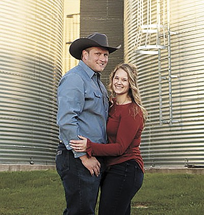 Zach Servais and Meghan (Skiba) Servais took engagement photos last summer near Stoddard, Wisconsin. The Servaises met during a University of Wisconsin-Madison Badger Dairy Club event. They milk 350 cows near Stoddard, Wisconsin. Photo courtesy of Bella Sollé Photography