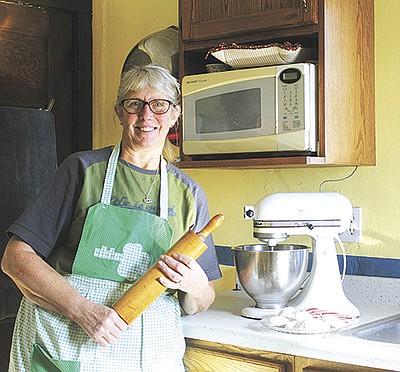 Janet Hetke stands in her farmhouse kitchen Nov. 25 where she runs CloverKey Kitchen near Ladysmith, Wisconsin. Hetke said baking brings her joy, and her small business is allowing her to live her dream. PHOTO BY DANIELLE NAUMAN