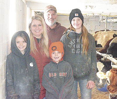 The Vesbach family – children McKenna (front, from left), Wyatt and Nicole Vesbach; (back) Amy Blaha and Chris Vesbach – take a break Jan. 29 at their farm near Hillsboro, Wisconsin. The Vesbaches milk 36 cows in Vernon County.  PHOTOS BY ABBY WIEDMEYER