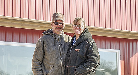 Jimmy and Michelle Woodard stand outside their new double-8 parallel pit parlor Feb. 17 on their farm near Winona, Minnesota. The Woodards transitioned out of a double-8 step-up parlor.  PHOTO BY GRACE JEURISSEN