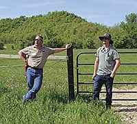 Beef grazier Rod Ofte (left) of Viola, Wis., and Vernon County Conservationist Ben Wojahn talk about a fence funded partly by the USDA’s Environmental Quality Incentives Program (EQIP). Ofte hosted a Kickapoo Grazing Initiative pasture walk May 22.<br /><!-- 1upcrlf -->PHOTO BY RON JOHNSON