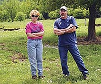 Susie and Doug Konichek are closing in on four years of milking on their own farm in Stueben, Wis. The Crawford County graziers hosted a pasture walk July 21, seeking advice on grazing 50 acres of woods and interseeding legumes and grasses in creek bottom pastures.<br /><!-- 1upcrlf -->PHOTO BY RON JOHNSON