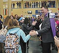 Midwest Dairy Association CEO Lucas Lentsch greets students the morning of Feb. 15 at Willow Creek Middle School in Rochester, Minn. The school is one of the many schools in 52 communities across the state that received a grant to  make a healthy breakfast more accessible.<br /><!-- 1upcrlf -->PHOTO BY KRISTA KUZMA