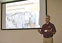 Eric Buchanan, a renewable energy scientist from the University of Minnesota, demonstrates the renewable energy tools the university has implemented at the Morris dairy during the conference June 13. <br /><!-- 1upcrlf -->PHOTO BY JENNIFER COYNE