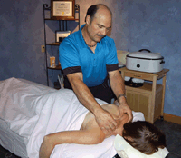 After having massages that relieved back pain and TMJ, Ken Griebel decided to pursue a second career as a certified massage therapist. He now works out of a chiropractic office in New Ulm. Most of his clients are seen for therapeutic reasons and pain relief from sore backs, stiff necks and other conditions. (photo by Krista Sheehan)