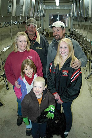 The whole Jeurissen family was on hand for the first milking on Nov. 5. They include Rick and Mindy and their children Genevieve (14), Grace (8), Samuel (5) and Rick’s dad, Bernard. (photo by Mark Klaphake)