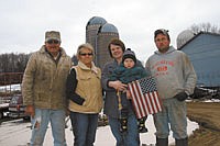 <p style="margin: 0.0px 0.0px 0.0px 0.0px; text-align: justify; font: 10.0px 'News Gothic MT';"><strong>John and Jeanne Rohl (left) are pictured with their son and daughter-in-law, John Jr. and Mackenzie, holding son, John III, on their 100-cow dairy near Prescott, Wis. The Rohls are members of the National Dairy Producers Organization. (photo by Krista M. Sheehan)</strong></p>