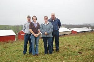 Claire Murral (second from left) is pictured with her husband, Sam (left), and her parents, Carol and Blair Heavilin. Blair and his brother, Brent, dairied on the 300-acre farm from the mid-1990s to 2006. Murral reestablished the dairy three years ago.  (photo submitted)