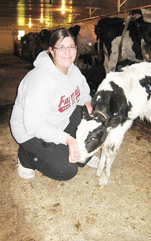 Hannah is currently in her second year at Anoka-Ramsey Community College studying criminal justice. She still lives at home, however, and spends much of her time on the family farm feeding cows and caring for the calves. (photo by Jennifer Burggraff)
