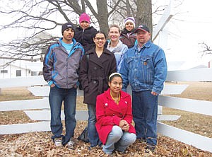 Jolene and Scott Tumberg are pictured with their five adopted children, (from left) Santiago, Amanda, Ruby, Anna and Amy, on their farm near New York Mills, Minn. The Tumbergs brought the siblings home for the first time on Dec. 12, 2006. (photo by Jennifer Burggraff)