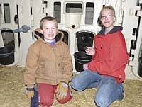 Joe and Cassidy are the children of Sheri and Charles Nienaber. They are pictured on their family’s dairy farm in Stearns County. Photo by Mark Klaphake