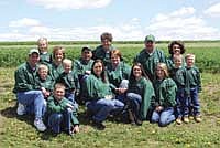 Each Knutson brother is pictured with his family: Mark and Andrea (left) with their kids, Christopher (front), Calvin and Joshua (center) and Jenna (back); Charles and Shelley (center) with their daughters, Karissa and Alexis; Ronald and Amy (right) with their kids, Carlee, Samual and Luke. The matriarch of the family, Elaine Knutson, is pictured in the center back.<br /><!-- 1upcrlf -->PHOTO SUBMITTED