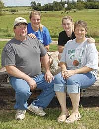 The Bachmann family – (from left) Jason, Ashley, Brittany and Nancy – milk around 50 cows on their farm near Frazee, Minn. For the last eight years, they have been actively showing dairy cattle as a family.<br /><!-- 1upcrlf -->PHOTO BY JENNFER BURGGRAFF