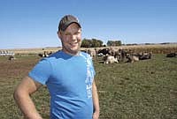 Paul Marx stands in the pasture with his herd of 52 cows on his farm in Mower County near Le Roy, Minn. Marx, who has been milking cows since 2009, is slowly working his way into the dairy industry by spending money wisely.<br /><!-- 1upcrlf -->PHOTO BY KRISTA SHEEHAN