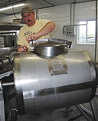 Al Bekkum prepares his churn. Bekkum and his wife, Sarah, own Nordic Creamery in Westby, Wis., where they package their butter with a manufacturing date. <br /><!-- 1upcrlf -->PHOTO BY RON JOHNSON
