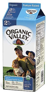John Palmer and his two kids, Ethan (6) and Norah (3), from Waukon, Iowa, are pictured on organic dairy farm. The carton of 2 percent milk will be distributed across the country as part of Organic Valley Cooperative’s marketing campaign.