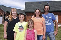 Melissa and Mike Woitalla have three children, from left, Tyler, Madison and Christina. Together they milk 30 cows and raise 300 steers and 15 beef cattle on their farm in Morrison County near Pierz, Minn.<br /><!-- 1upcrlf -->PHOTO BY MARK KLAPHAKE