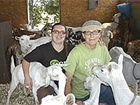 Lynne Reeck (left) and Kate Wall pose with two of their goats on their farm, Singing Hills Dairy. The couple milks 30 goats and makes fresh cheese on the their farmsite in Rice County near Nerstrand, Minn. <br /><!-- 1upcrlf -->PHOTO BY KRISTA KUZMA
