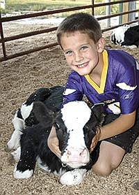 Logan Brand would have a farm like his parents’ if he had his own dairy. He likes all the cows on the farm. <br /><!-- 1upcrlf -->PHOTO BY KRISTA KUZMA