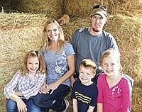 Jessica and Alan Klimek have three children, from left, Lexi, Derek and Hailey. Together they milk 80 cows on their farm in Douglas County near Alexandria, Minn.<br /><!-- 1upcrlf -->PHTOO BY MISSY MUSSMAN