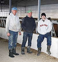 From left, Leo, Keith, and Adam Schulte, built a new 216-stall freestall barn and a 1.5 million gallon manure pit on their farm near Dorchester, Iowa. The Schultes are certified organic dairy producers.