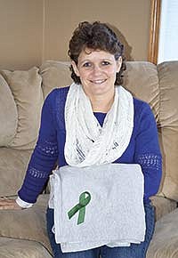 Sherry Bertram donated one of her kidneys on Jan. 31, 2013, to her older brother, Rick Burg, who was dealing with Polycystic Kidneys. Bertram, her husband, Randy, and their children, Amanda (20), Ashley (18), Tyler (16) and Travis (13), milk 50 cows in a stanchion barn on their farm near Spring Hill, Minn. <br /><!-- 1upcrlf -->PHOTO BY MISSY MUSSMAN