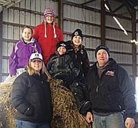 Sarah and Perry Kuechle are shown with their four children – Sawyer, Sidney, Porter, and Shelby. The Kuechles milk 200 cows with Perry’s sisters – Rhonda and Brenda Kuechle, and Becky Haag – near Eden Valley, Minn. in Stearns County.<br /><!-- 1upcrlf -->PHOTO SUBMITTED