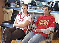 Assia and Mike Schleper take time to watch Anne play during the 2014 winter Olympics in Sochi.<br /><!-- 1upcrlf -->PHOTO BY MISSY MUSSMAN