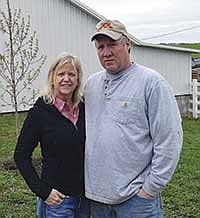 Brenda White and Rich McNamara stand in front of a tree planted on Rich’s farm in memory of his son, Derek, who was killed in an ATV accident on April 25. <br /><!-- 1upcrlf -->PHOTO BY KRISTA KUZMA