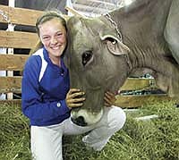 Meghan Douglas earned grand champion honors of the Brown Swiss show with her 3-year-old cow during the junior show at the Wisconsin State Fair in West Allis, Wis. <br /><!-- 1upcrlf -->PHOTO BY NICOLE SMITH