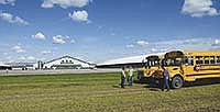 Buses wait to bring visitors on a tour through Riverview Dairy’s 120-acre site. Tours were part of Riverview’s sixth annual open house on June 25 near Morris, Minn., in Stevens County.<br /><!-- 1upcrlf -->PHOTO BY MARIA HAGER