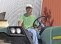 Justin Kotten enjoys all parts of working on the Hirsch farm, but has special knowledge about tractors, as he also works at the John Deere dealer in Sleepy Eye, Minn.<br /><!-- 1upcrlf -->PHOTO BY RUTH KLOSSNER